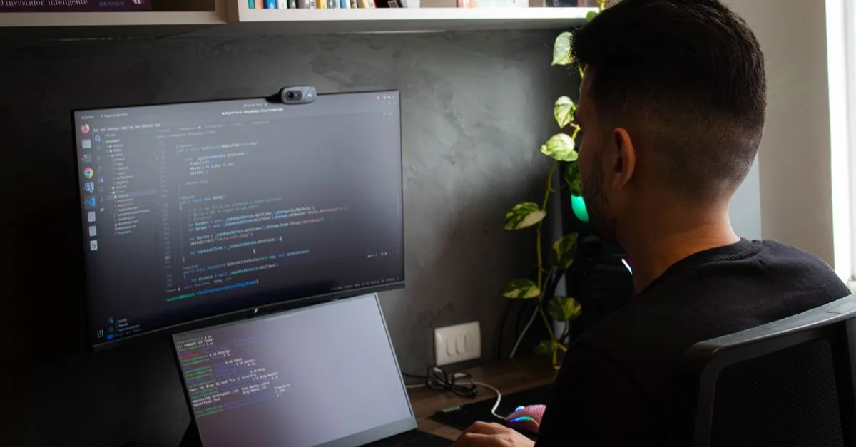 Engineer reviewing an AWS architecture diagram on a monitor during a cloud migration