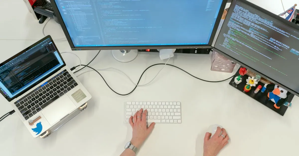 Database administrator analysing query performance and replication status on screen